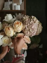Person holding flowers
