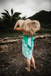 Woman standing on brown soil ground