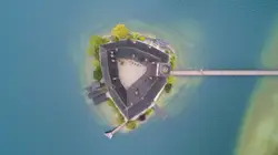 An aerial view of an island in the middle of the ocean