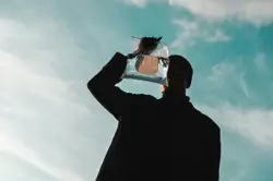 Person holding clear plastic pack
