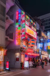 Vibrant neon lights illuminate a bustling street scene 