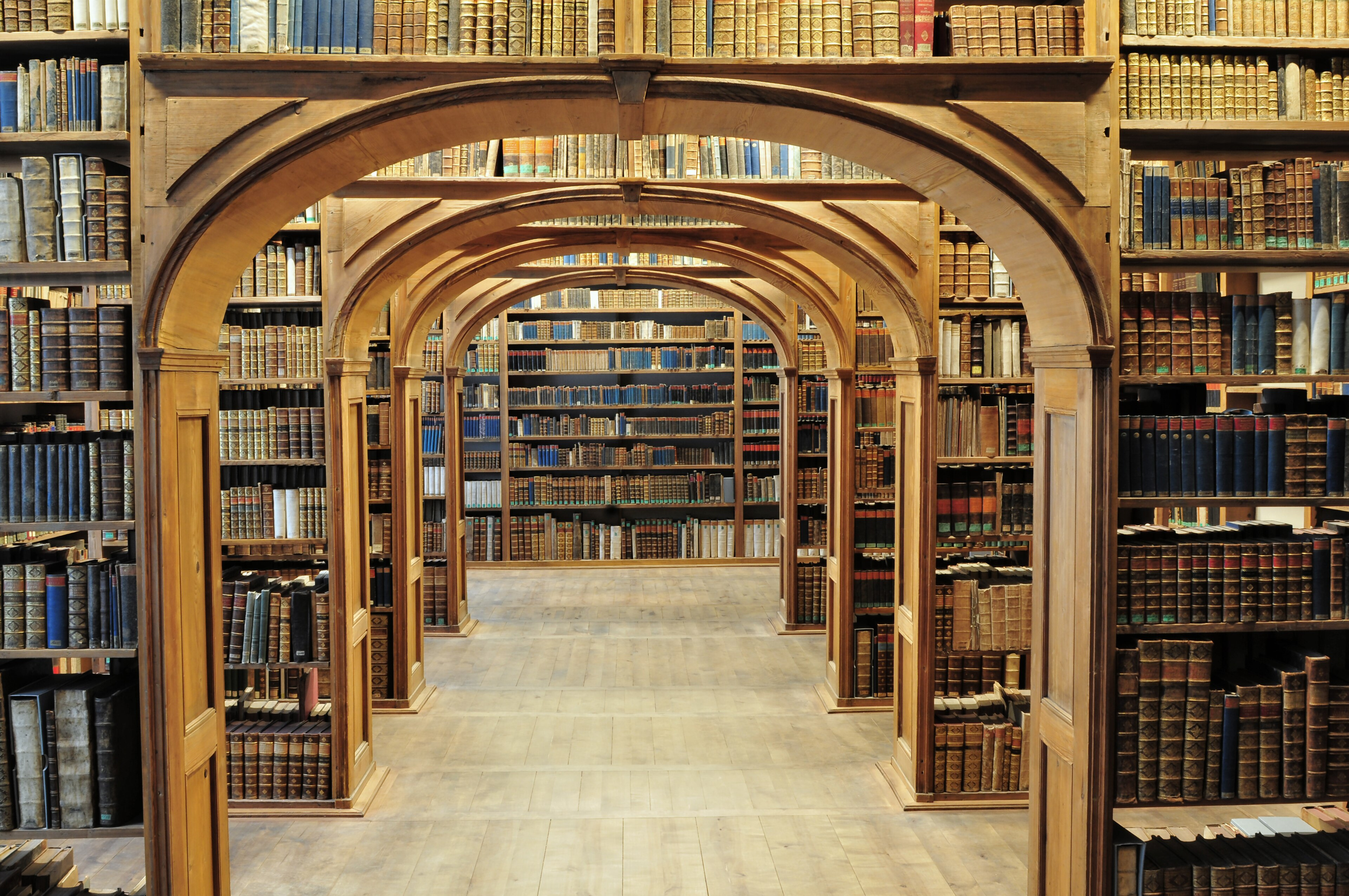 Large Room With Many Shelves And A Large Clock