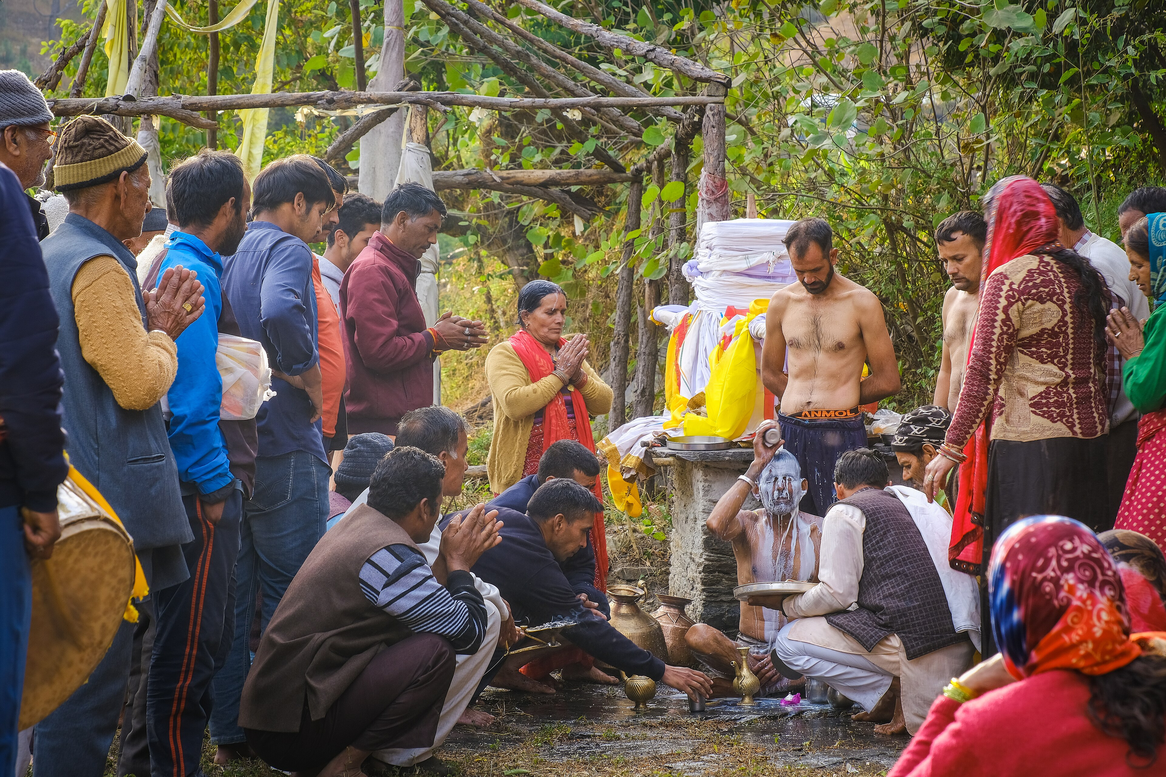 People Are Gathered Around A Fire Hydrant