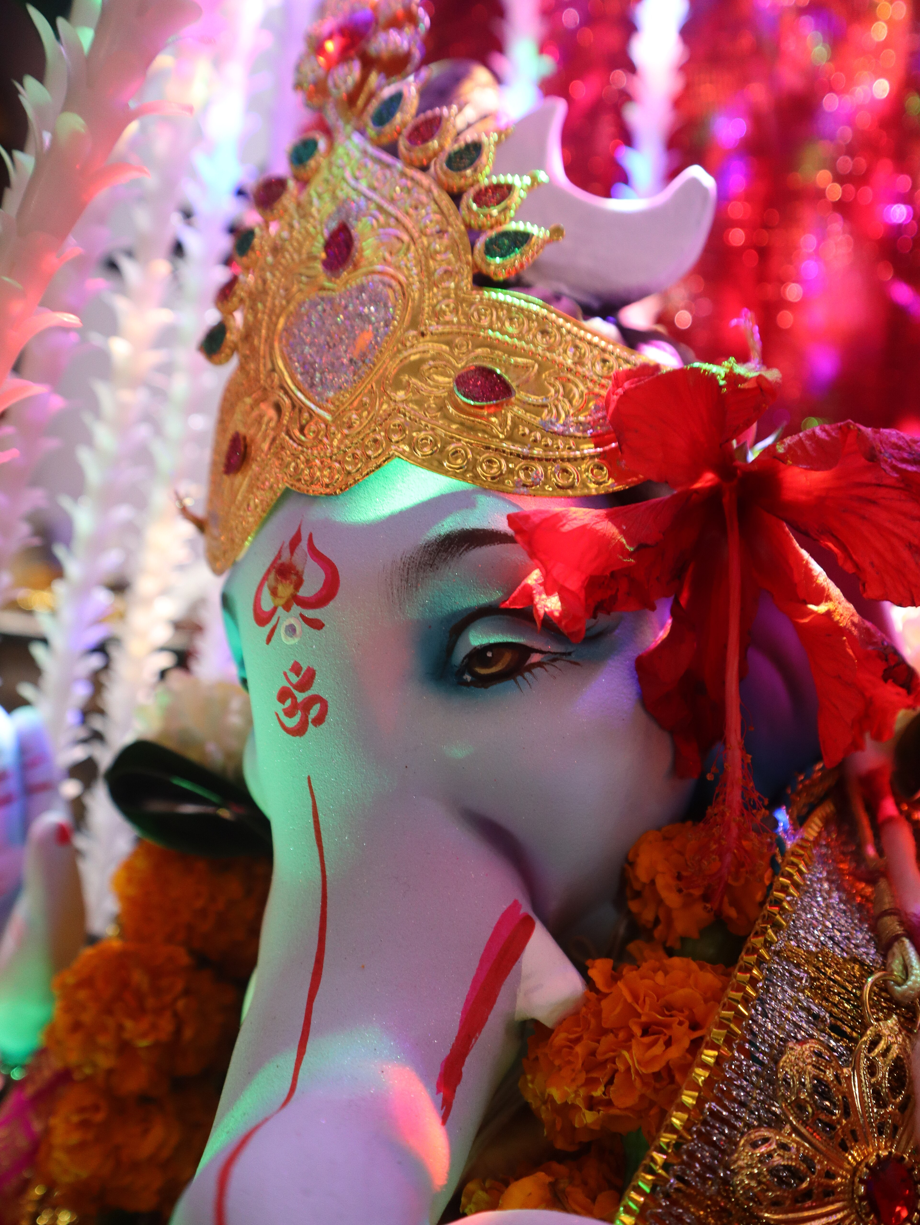 Statue Of A Woman With A Red Headdress