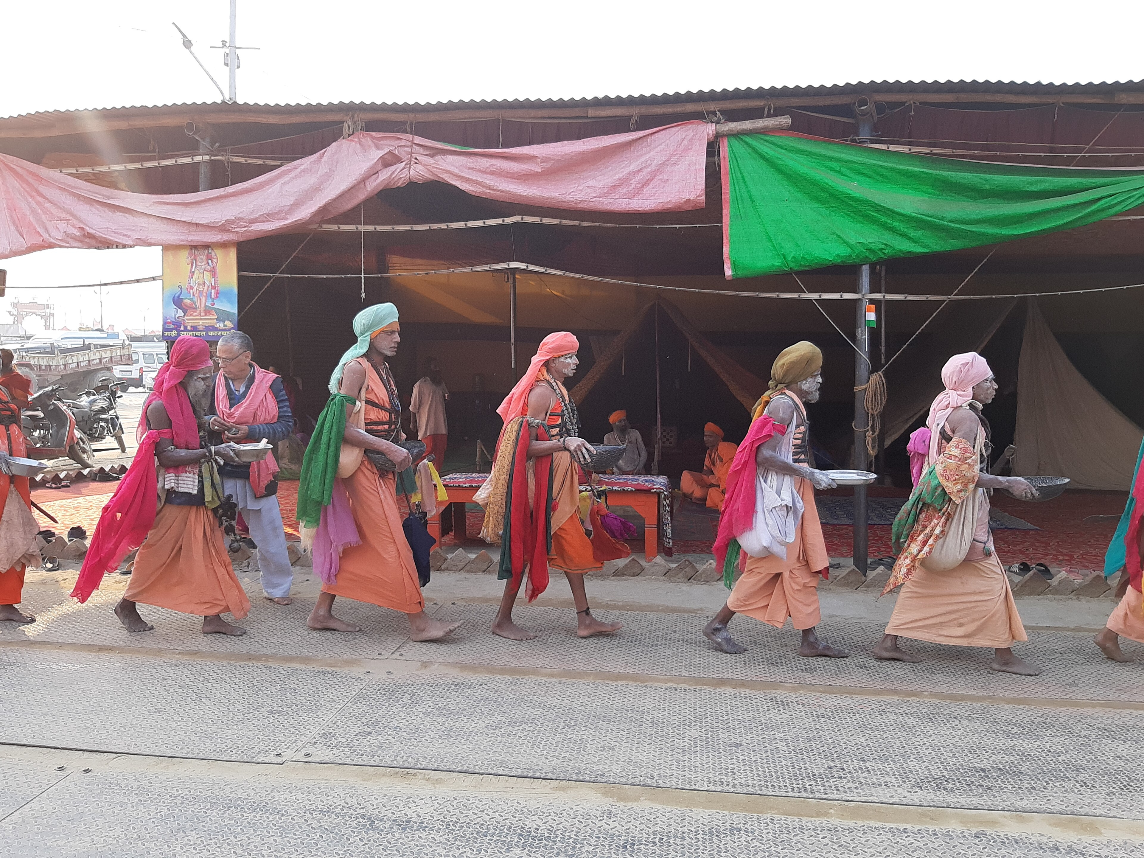 Crowd Of People Dressed In Costumes Standing Around A Tent