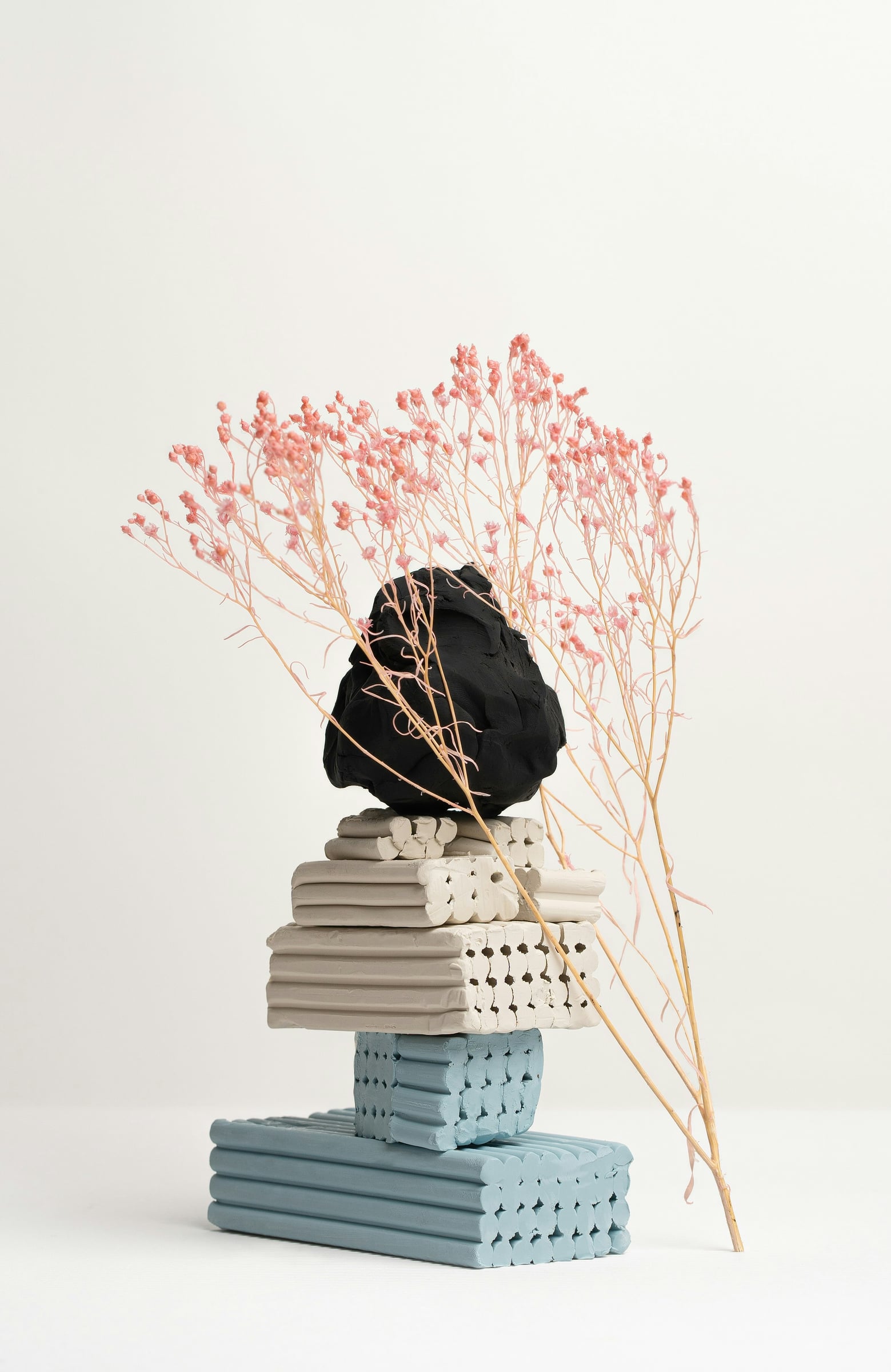 Flower Arrangement Is In A Vase On A Table
