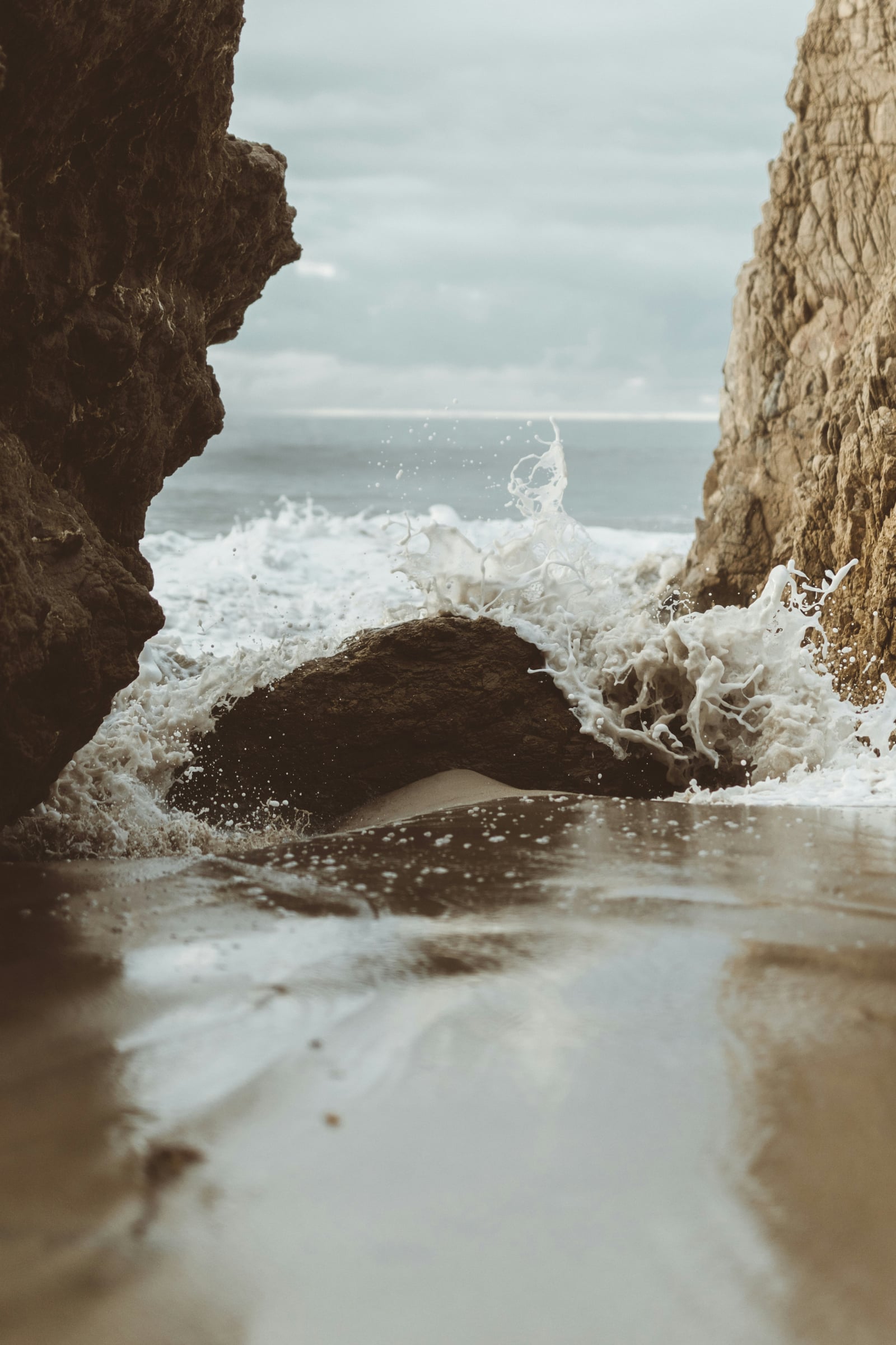 Lone Surfer Is On The Beach Near The Waves