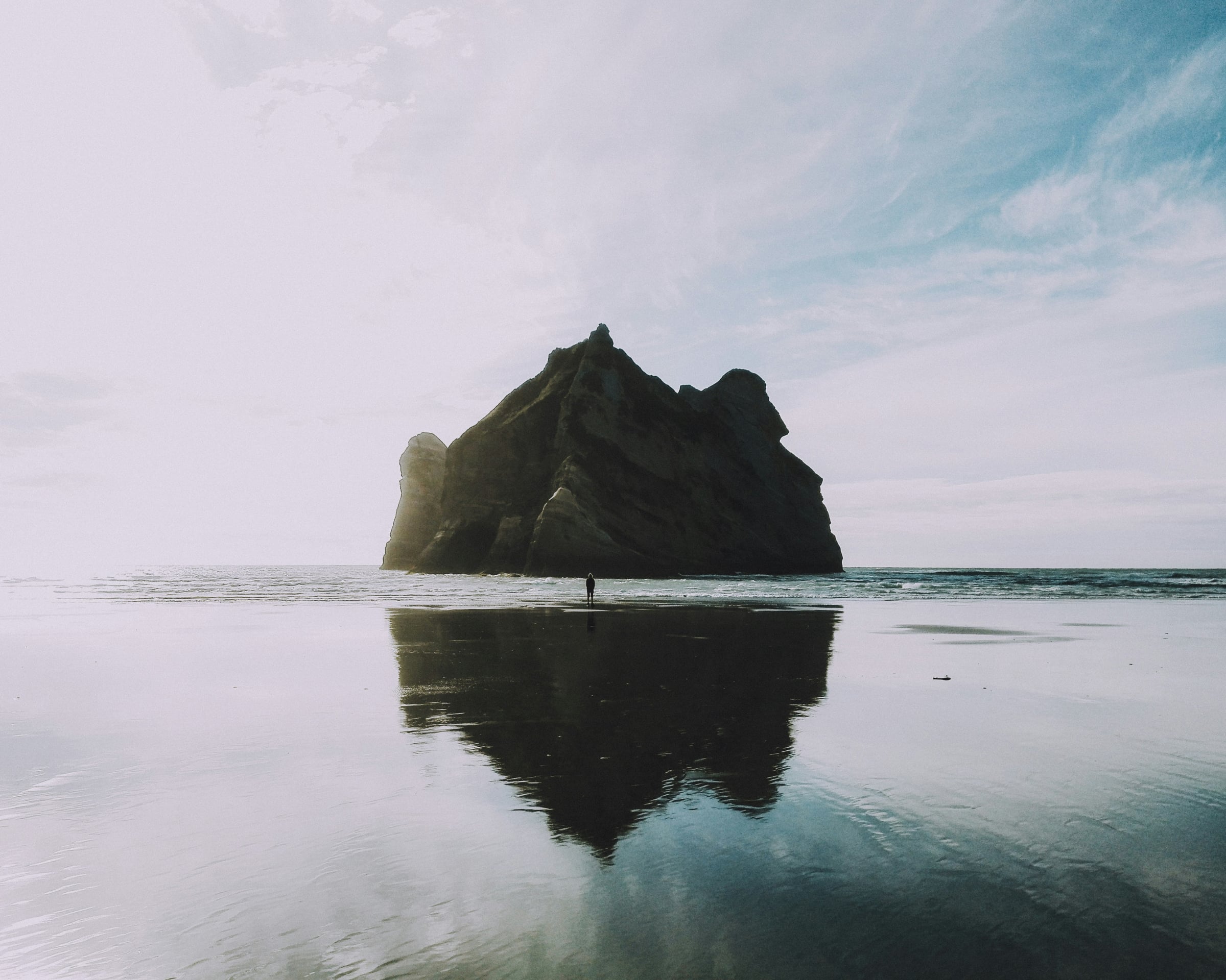 Large Body Of Water With A Mountain