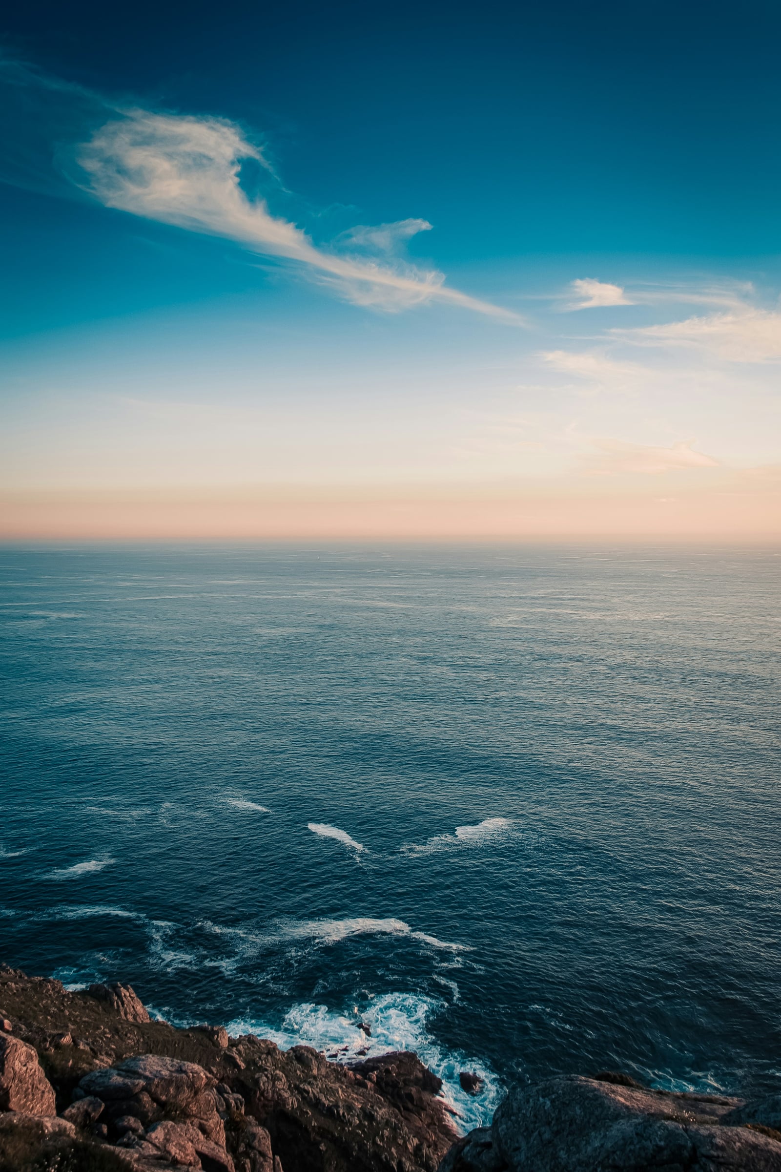 Large Body Of Water With A Lighthouse